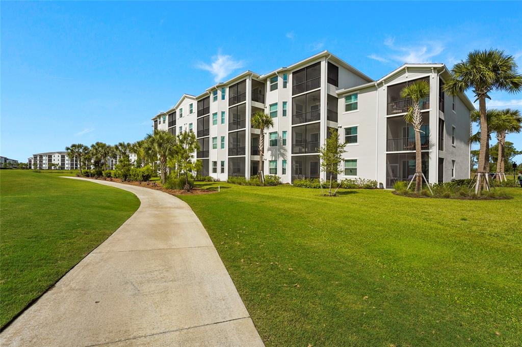 43985 Boardwalk Loop, Unit 2124 Punta Gorda, FL 33982 - Photo 38 of 80 a view of building with yard
