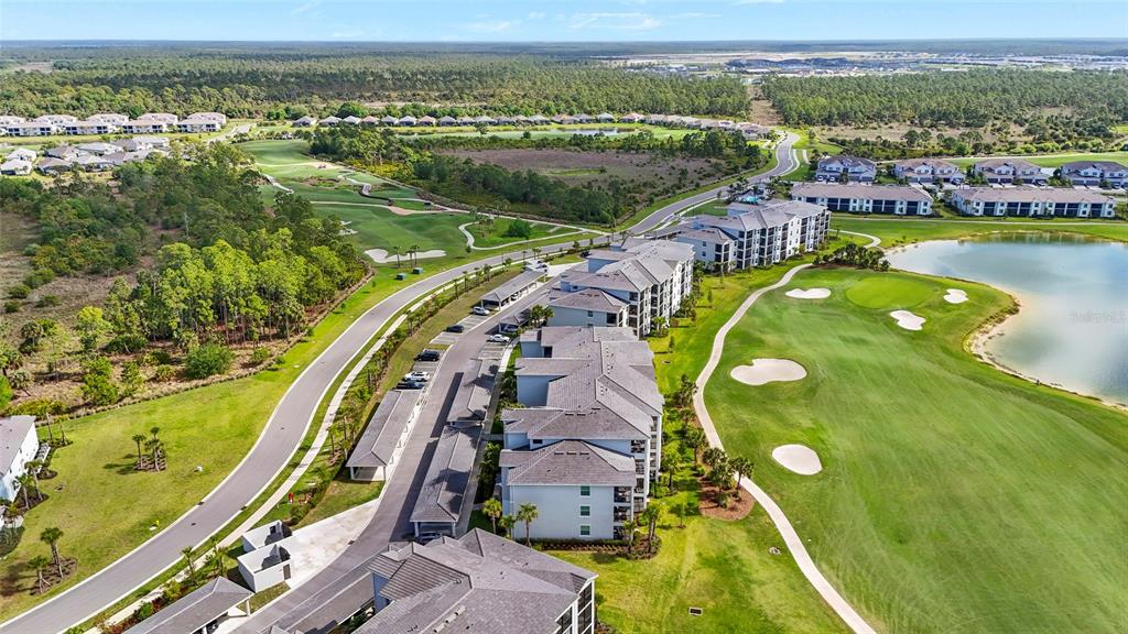 43985 Boardwalk Loop, Unit 2124 Punta Gorda, FL 33982 - Photo 42 of 80 an aerial view of residential houses with outdoor space and swimming pool