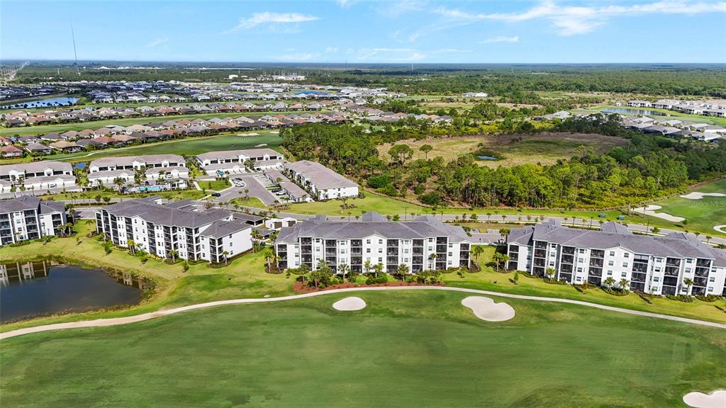 43985 Boardwalk Loop, Unit 2124 Punta Gorda, FL 33982 - Photo 44 of 80 an aerial view of residential houses with outdoor space and swimming pool