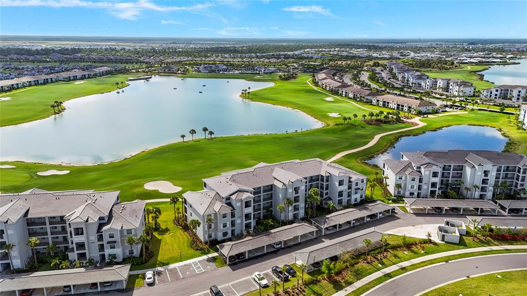 43985 Boardwalk Loop, Unit 2124 Punta Gorda, FL 33982 - Photo 48 of 80 a view of a city with lawn chairs