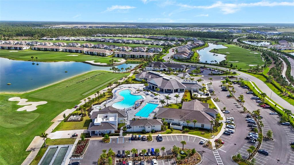 43985 Boardwalk Loop, Unit 2124 Punta Gorda, FL 33982 - Photo 52 of 80 an aerial view of a city with lots of residential buildings ocean and mountain view in back