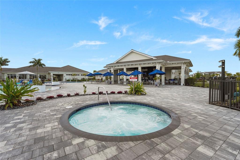 43985 Boardwalk Loop, Unit 2124 Punta Gorda, FL 33982 - Photo 64 of 80 a view of a house with swimming pool and sitting area