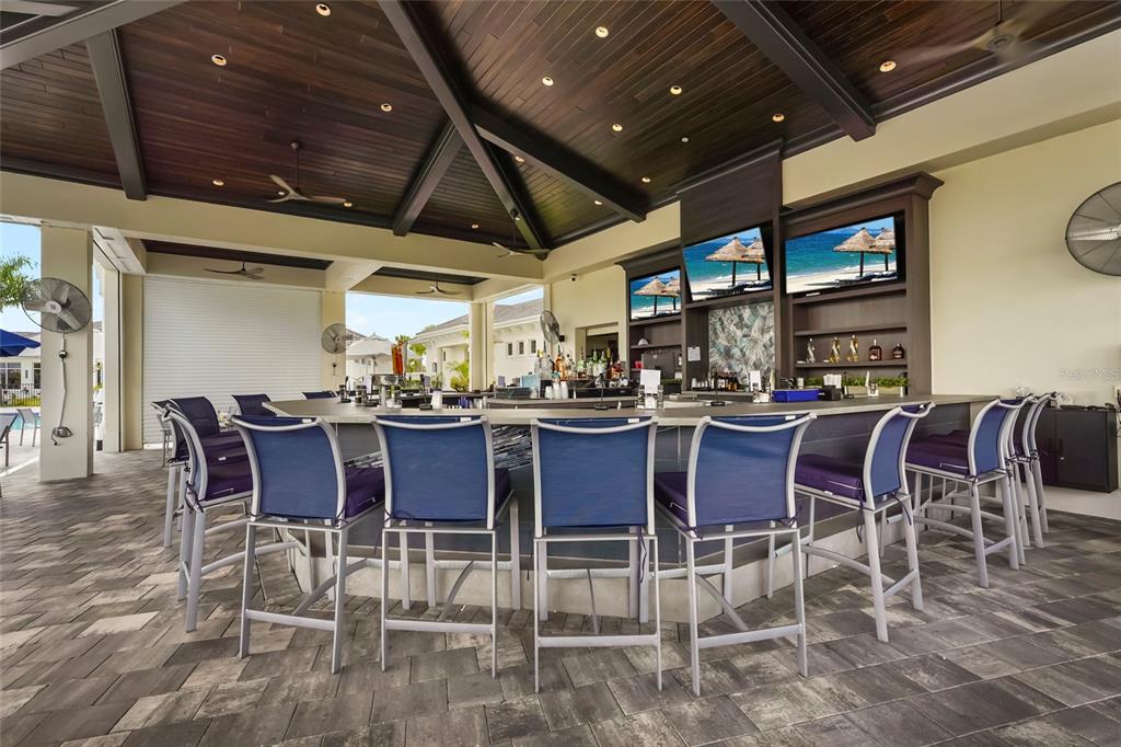 43985 Boardwalk Loop, Unit 2124 Punta Gorda, FL 33982 - Photo 68 of 80 a dining room with furniture a rug and a chandelier