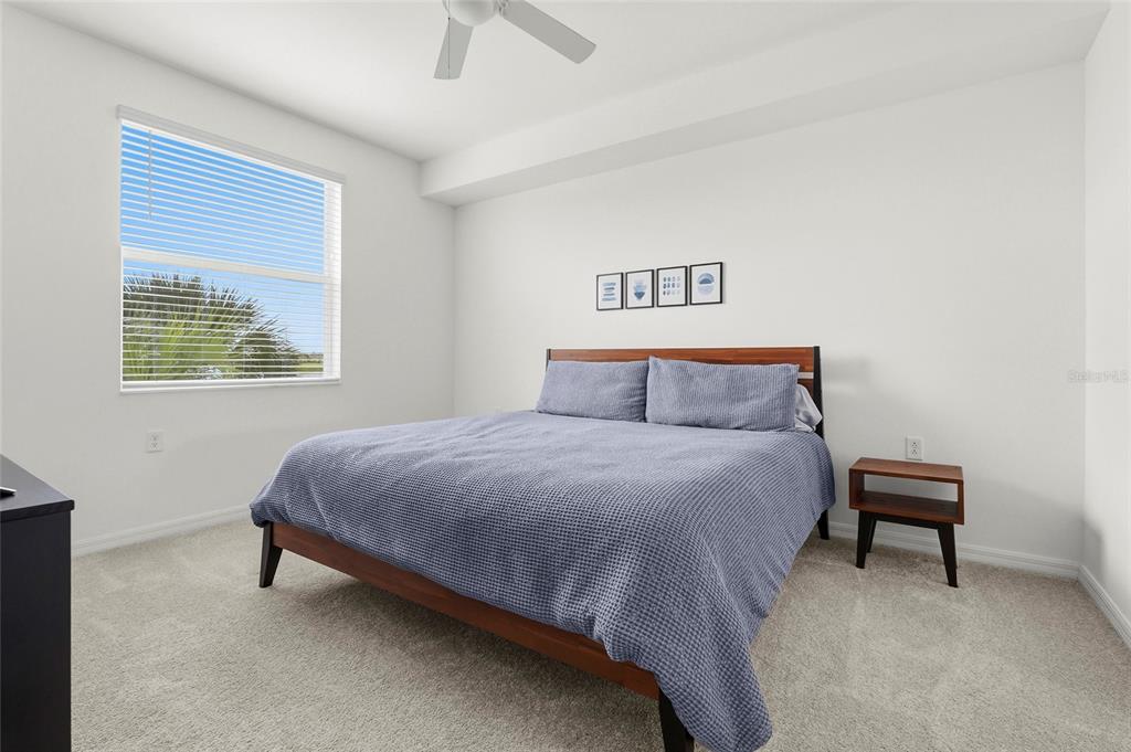 43985 Boardwalk Loop, Unit 2124 Punta Gorda, FL 33982 - Photo 7 of 80 a bedroom with a bed table chair and a window