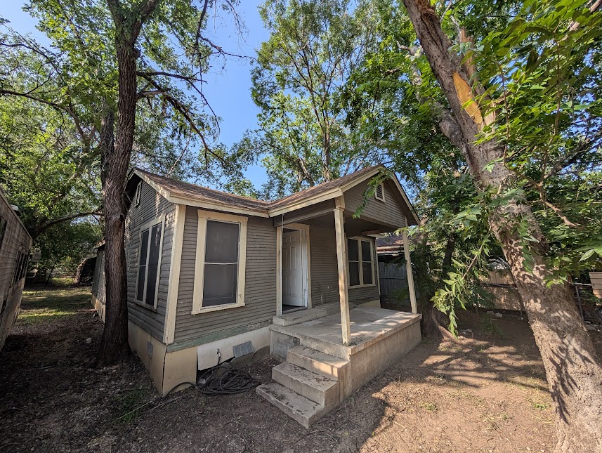 3208 East 16th Street Austin, TX 78721 - Photo 4 of 11 A charming, tree-shaded home awaits with a welcoming covered front porch.
