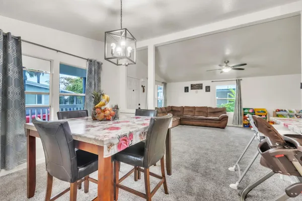 a view of a dining room with furniture window and wooden floor