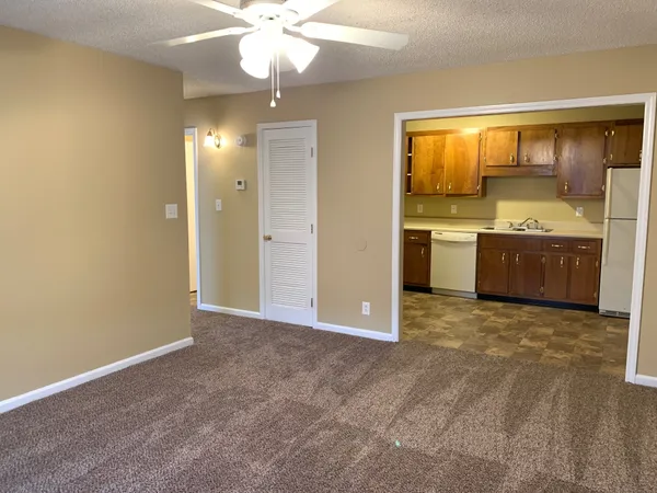 a view of a kitchen with a stove cabinets and a wooden floor