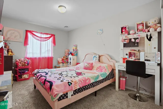 a bedroom with a bed and cabinets