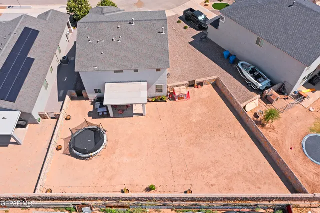 a view of house with backyard and deck