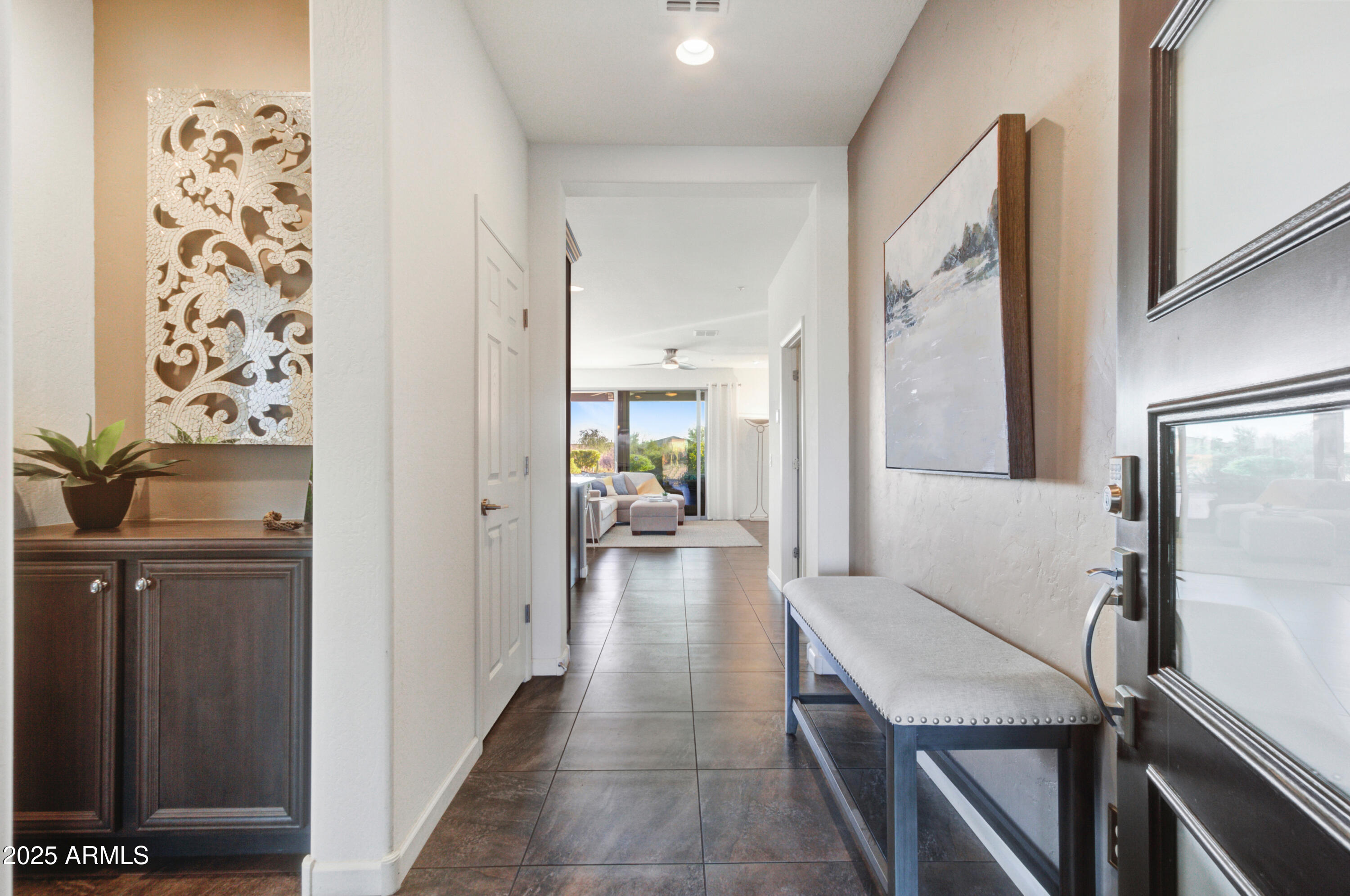 17919 East Slide Rock Drive Rio Verde, AZ 85263 - Photo 4 of 48 a view of a hallway with living room and furniture