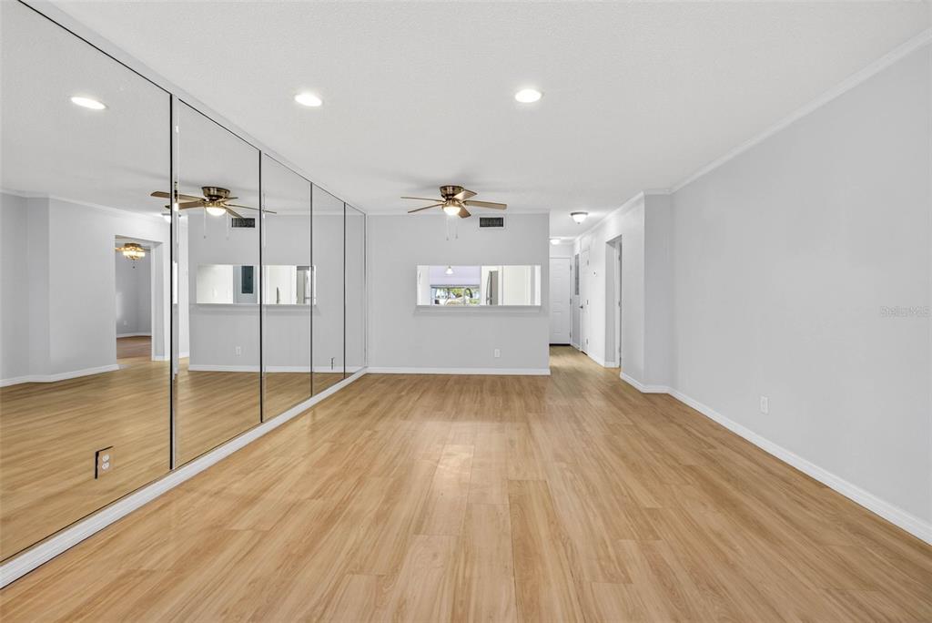5197 Silent Loop, Unit 124 New Port Richey, FL 34652 - Photo 21 of 55 a view of empty room with wooden floor