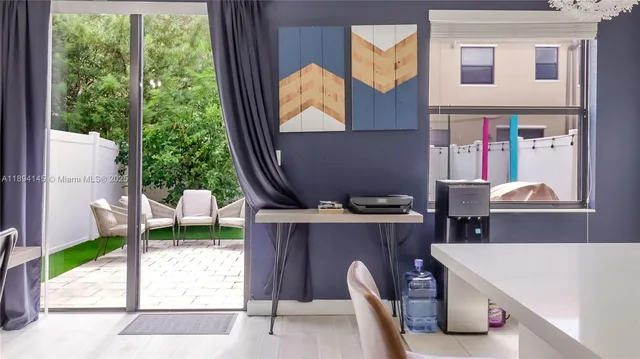 a room that has a bed and a table in it