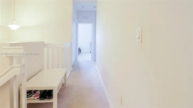 a hallway with white walls