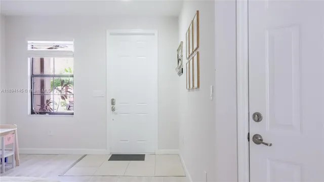 a bathroom with a granite countertop shower and a sink