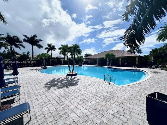 a view of a swimming pool with a patio