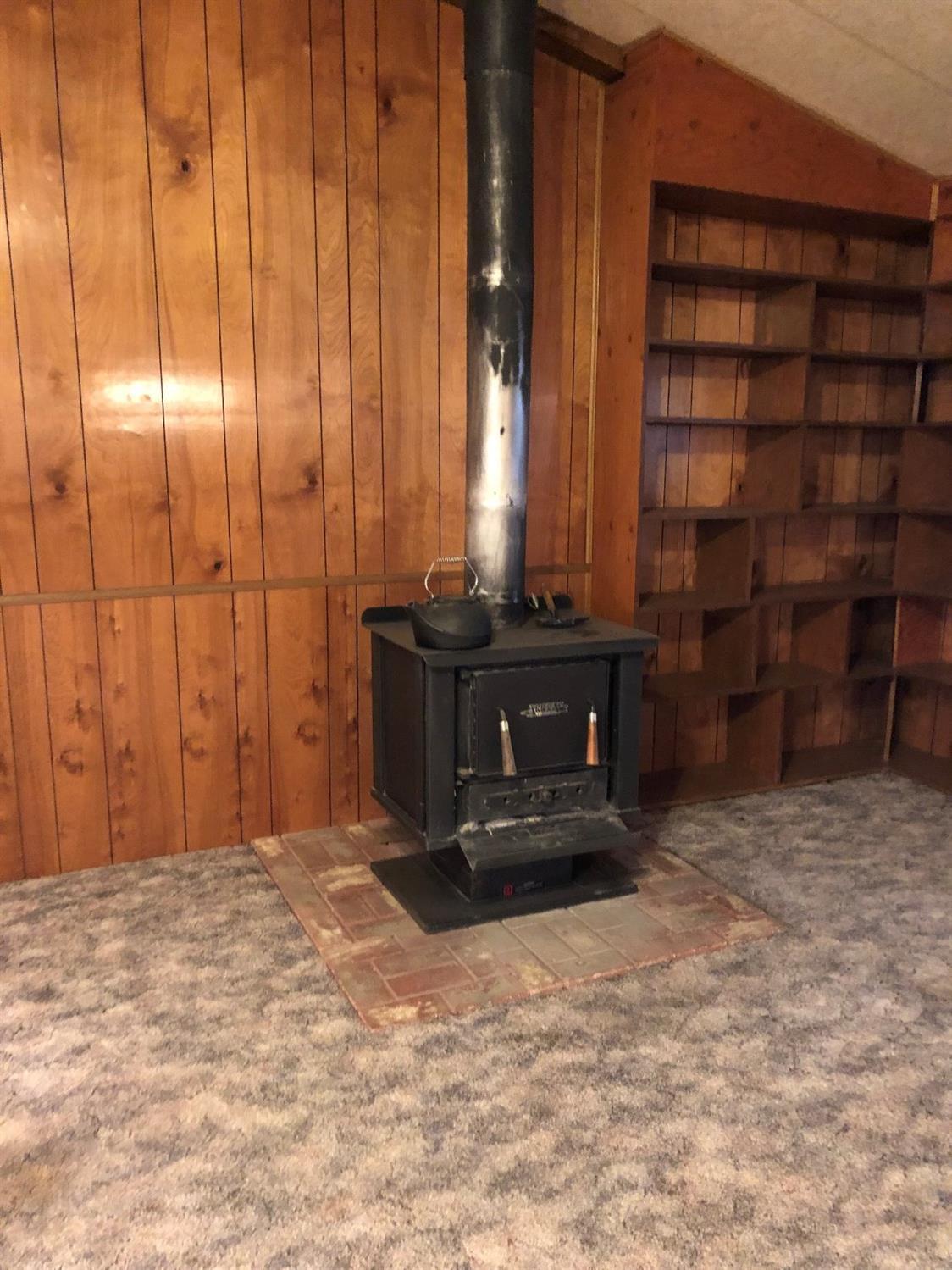 6226 East Evans Creek Road, Unit 15 Rogue River, OR 97537 - Photo 9 of 30 a view of an empty room with a cabinet