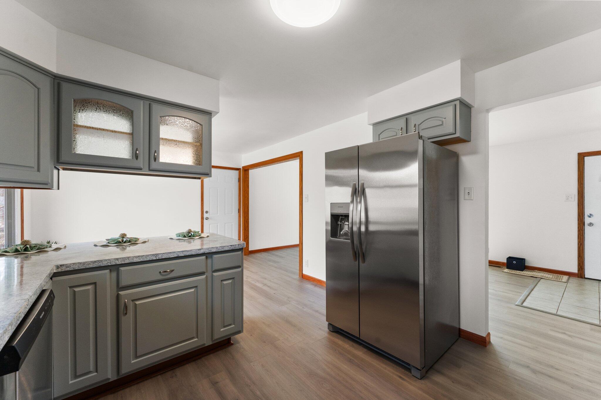 10473 North 493 East Demotte, IN 46310 - Photo 15 of 35 a kitchen with stainless steel appliances granite countertop a refrigerator and a sink