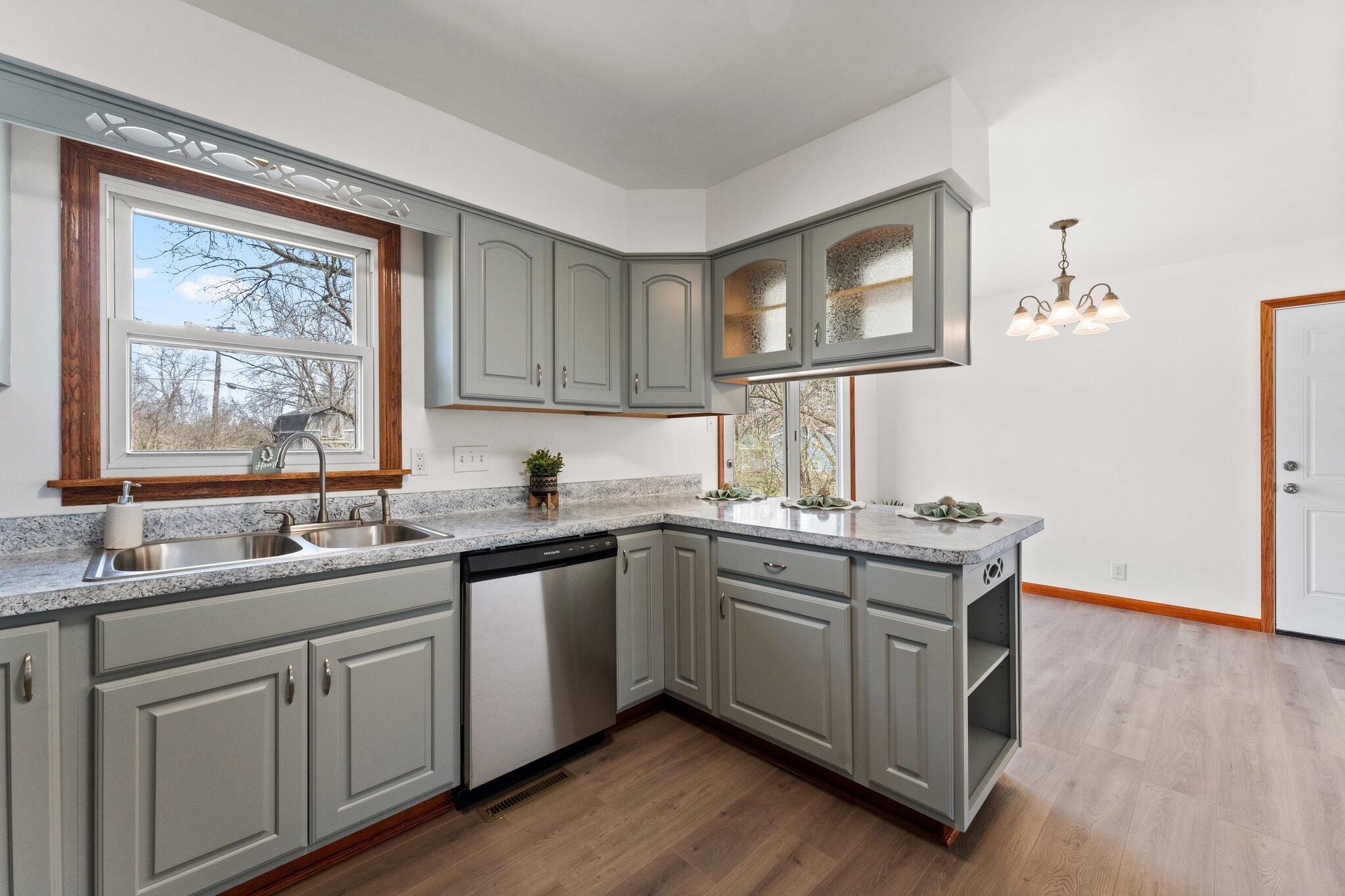 10473 North 493 East Demotte, IN 46310 - Photo 16 of 35 a kitchen with a sink cabinets and window