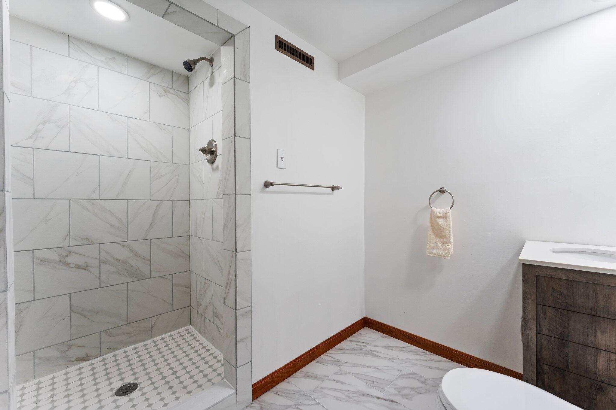 10473 North 493 East Demotte, IN 46310 - Photo 25 of 35 a bathroom with a shower and toilet