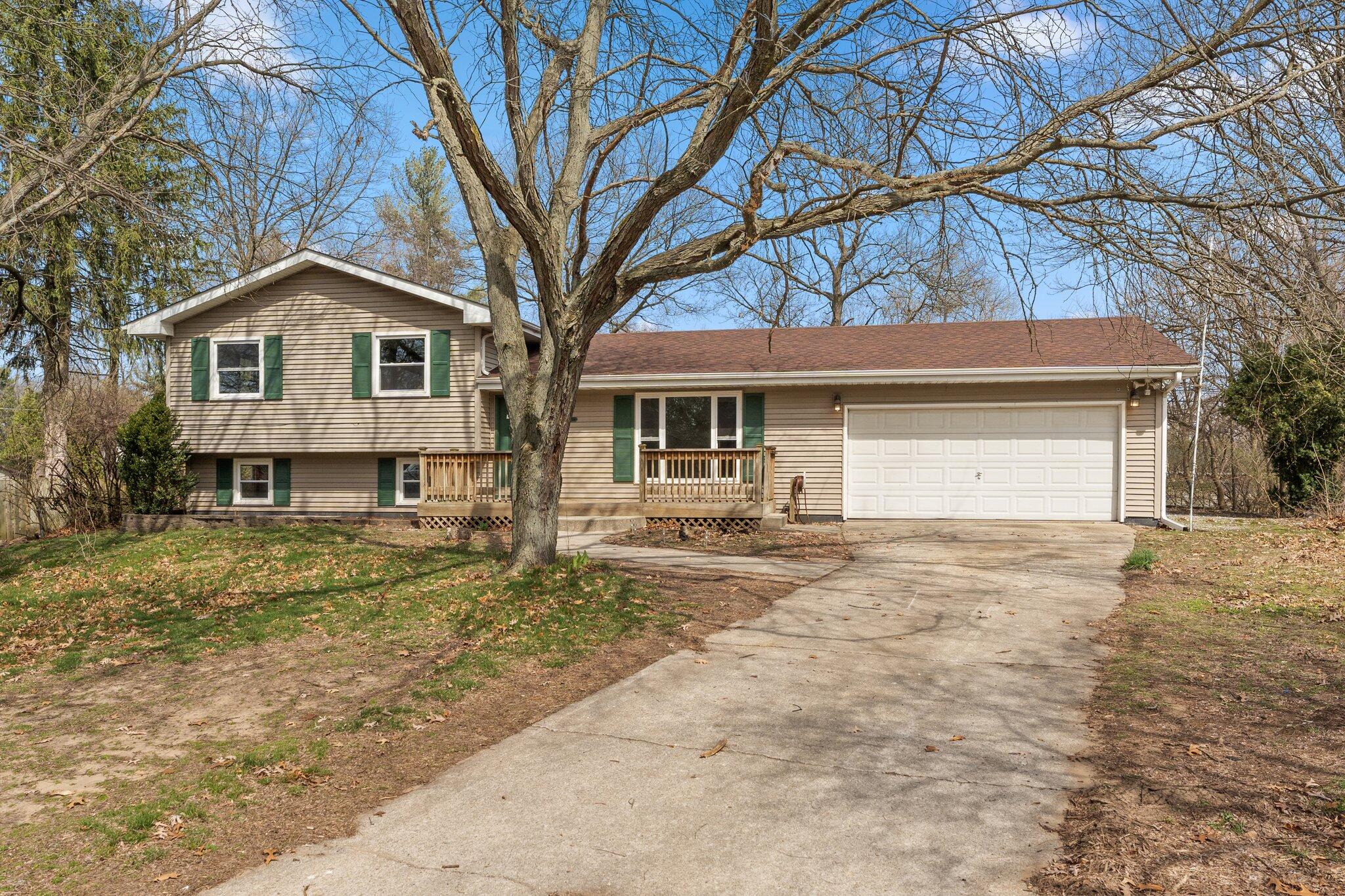 10473 North 493 East Demotte, IN 46310 - Photo 34 of 35 a front view of a house with a yard and garage