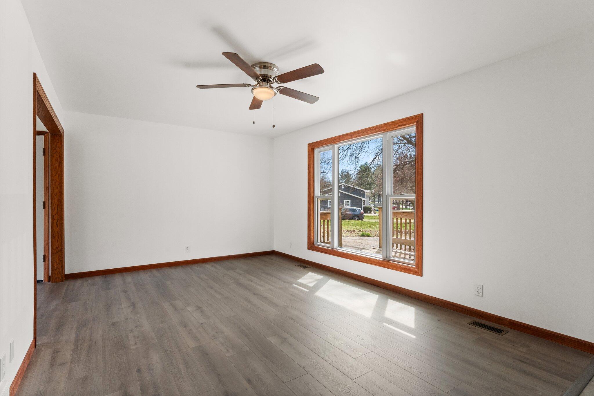 10473 North 493 East Demotte, IN 46310 - Photo 6 of 35 a view of an empty room with wooden floor and a window