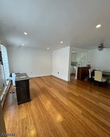 a room with wooden floor and furniture