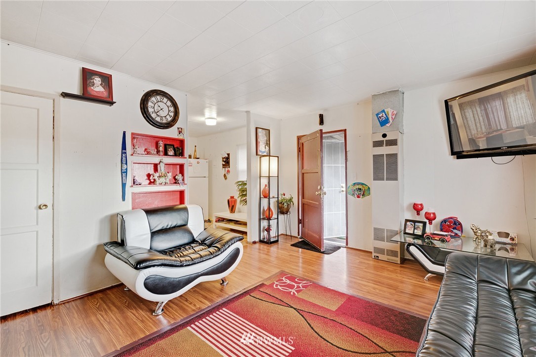 2906 Northeast 6th Place Renton, WA 98056 - Photo 11 of 21 a living room with furniture and wooden floor