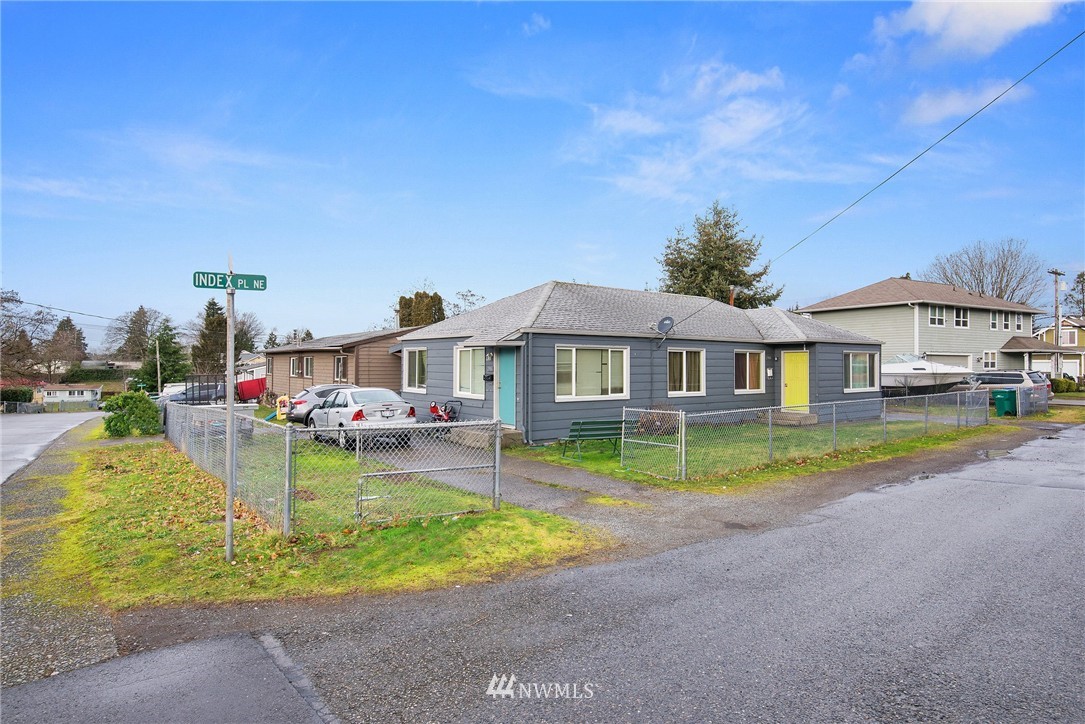 2906 Northeast 6th Place Renton, WA 98056 - Photo 3 of 21 a view of house with garden and swimming pool