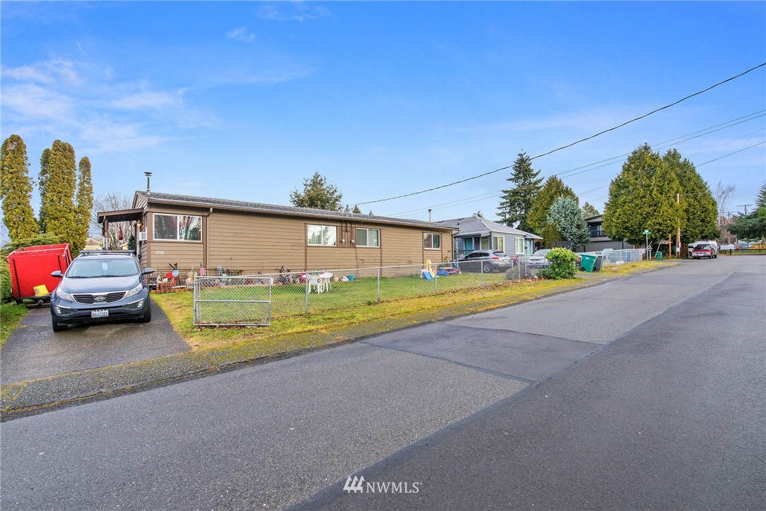 2906 Northeast 6th Place Renton, WA 98056 - Photo 4 of 21 a car parked on the side of the road