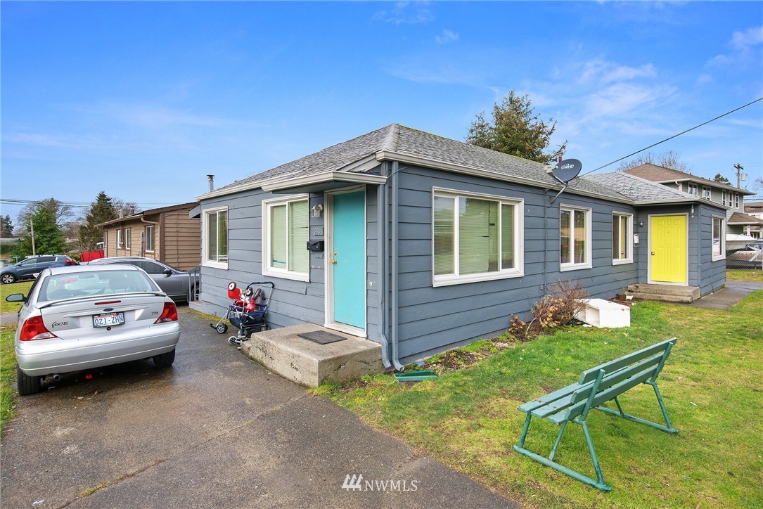 2906 Northeast 6th Place Renton, WA 98056 - Photo 7 of 21 a car parked in front of a house