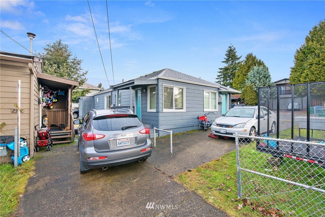 2906 Northeast 6th Place Renton, WA 98056 - Photo 8 of 21 a car parked in front of a house