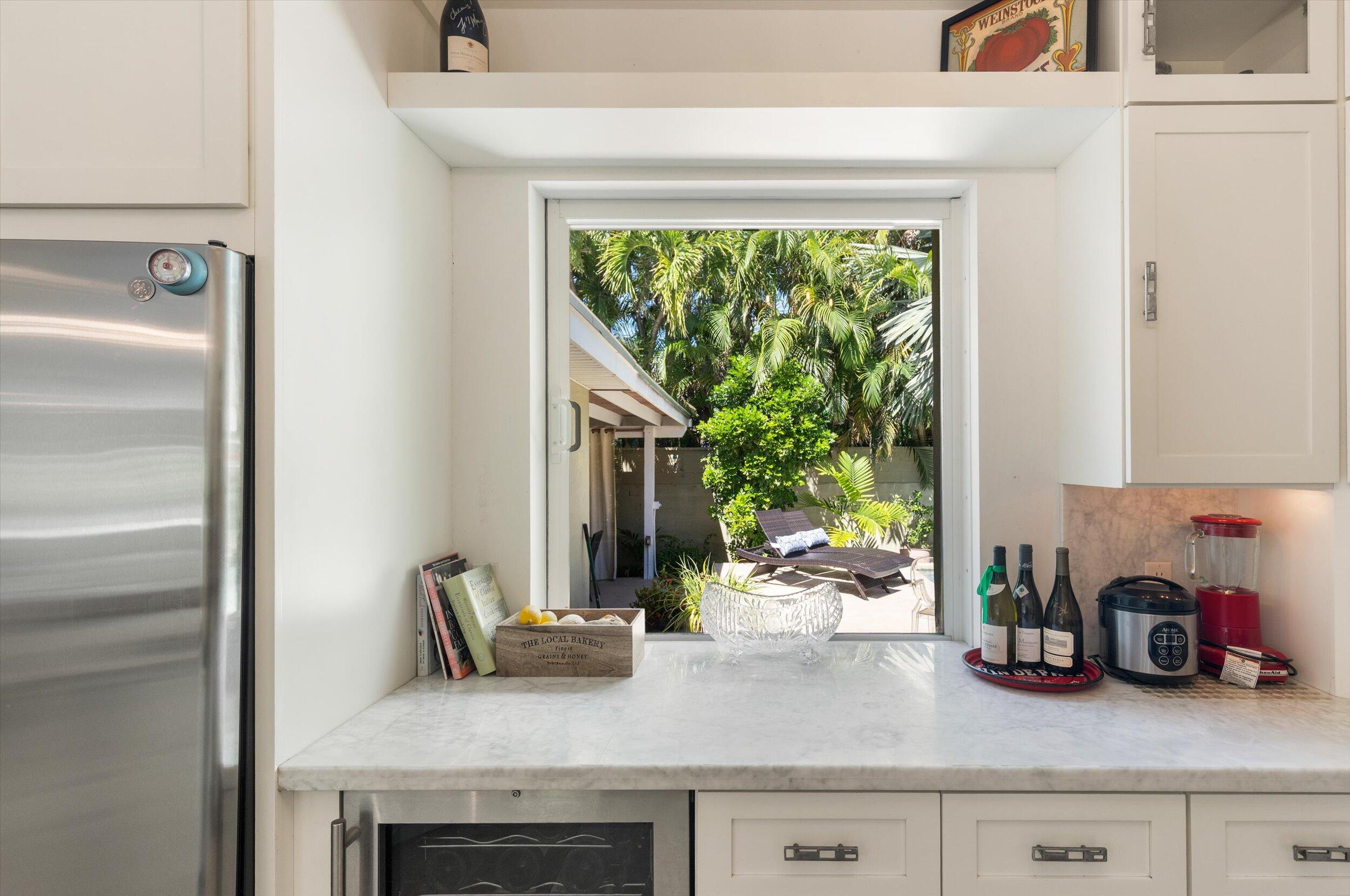 1719 Laird Street Key West, FL 33040 - Photo 17 of 39 a kitchen with a sink and a large window