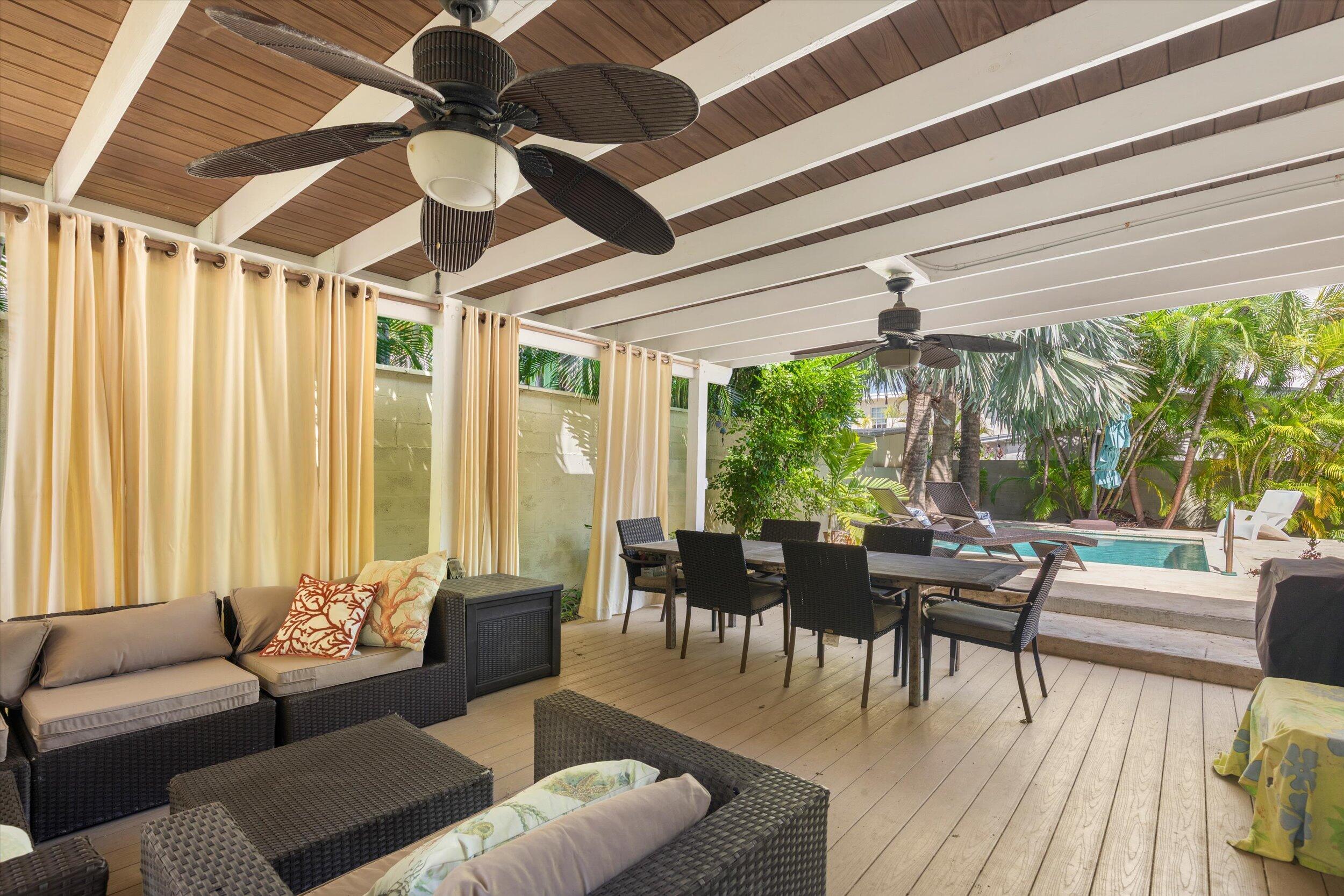 1719 Laird Street Key West, FL 33040 - Photo 2 of 39 a living room with furniture and a large window