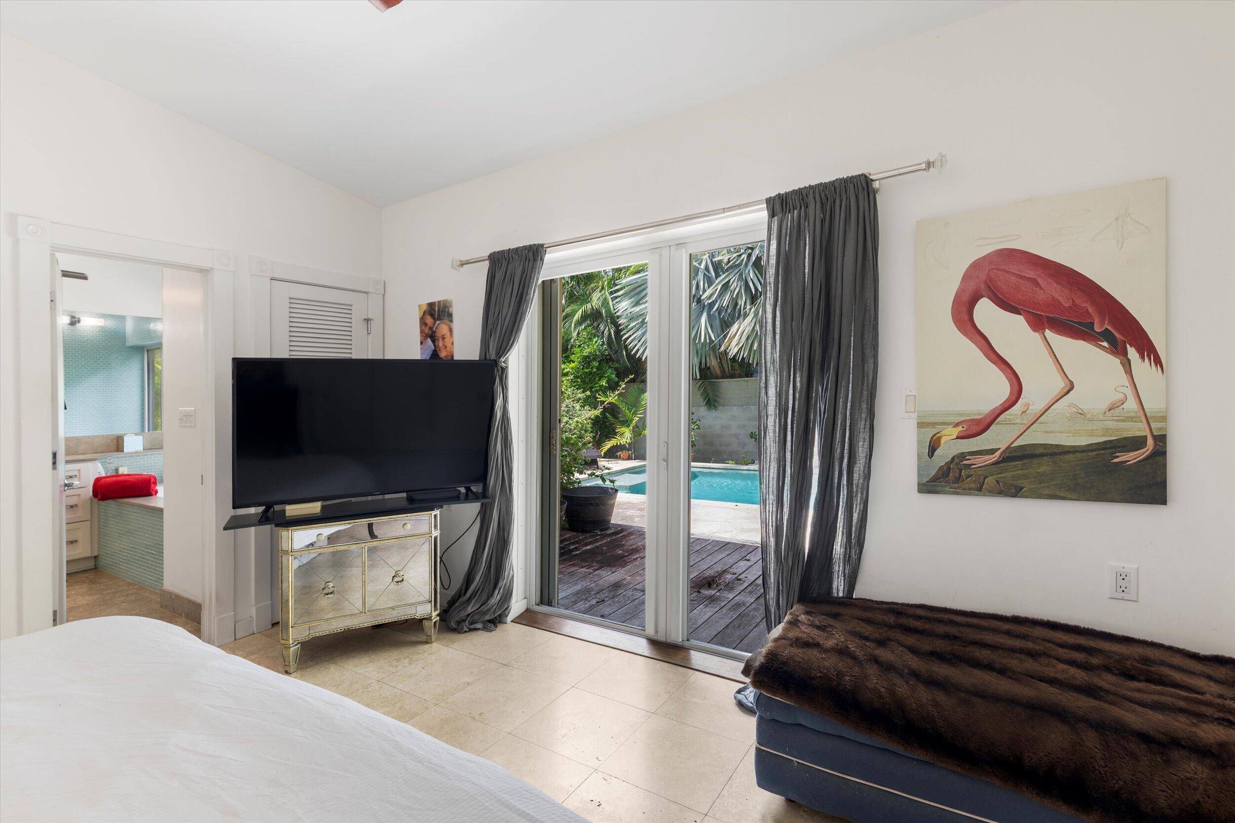 1719 Laird Street Key West, FL 33040 - Photo 29 of 39 a living room with furniture and a flat screen tv