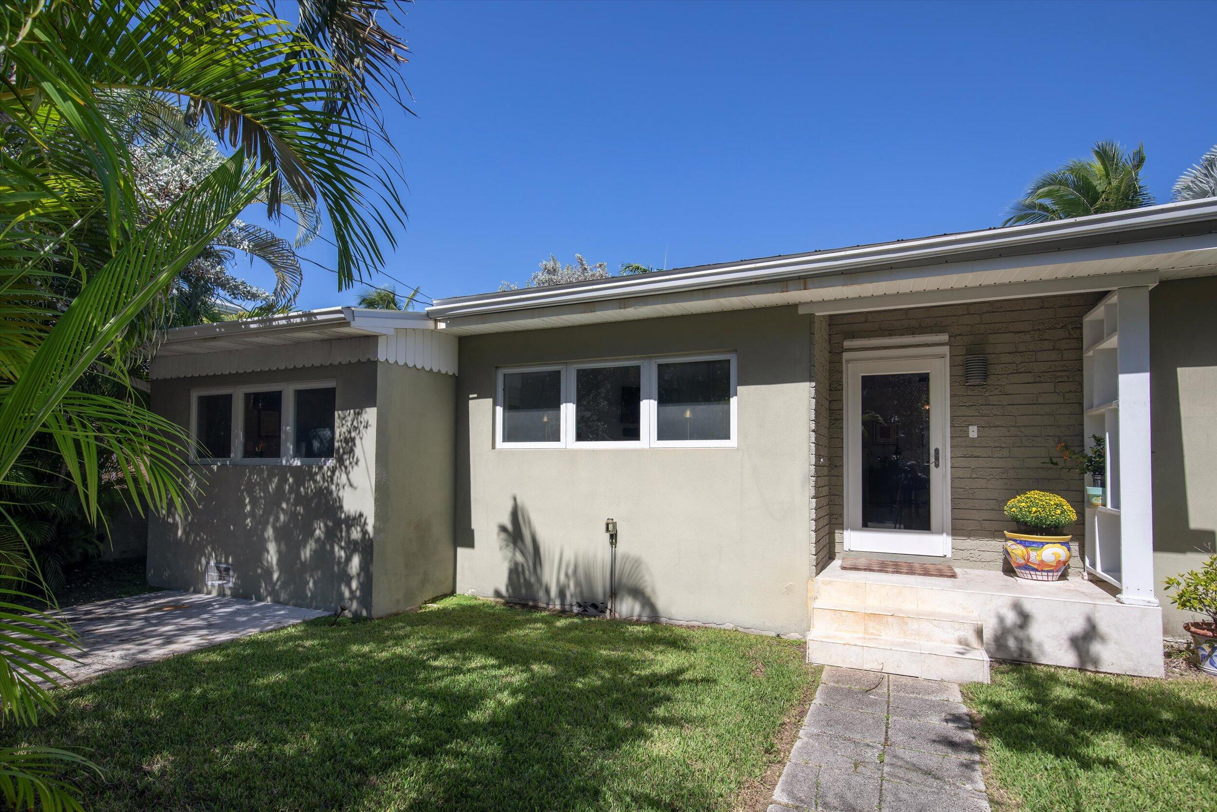 1719 Laird Street Key West, FL 33040 - Photo 4 of 39 a front view of a house with a garden