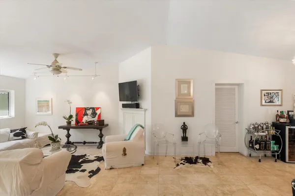 a room with gym equipment and a flat screen tv