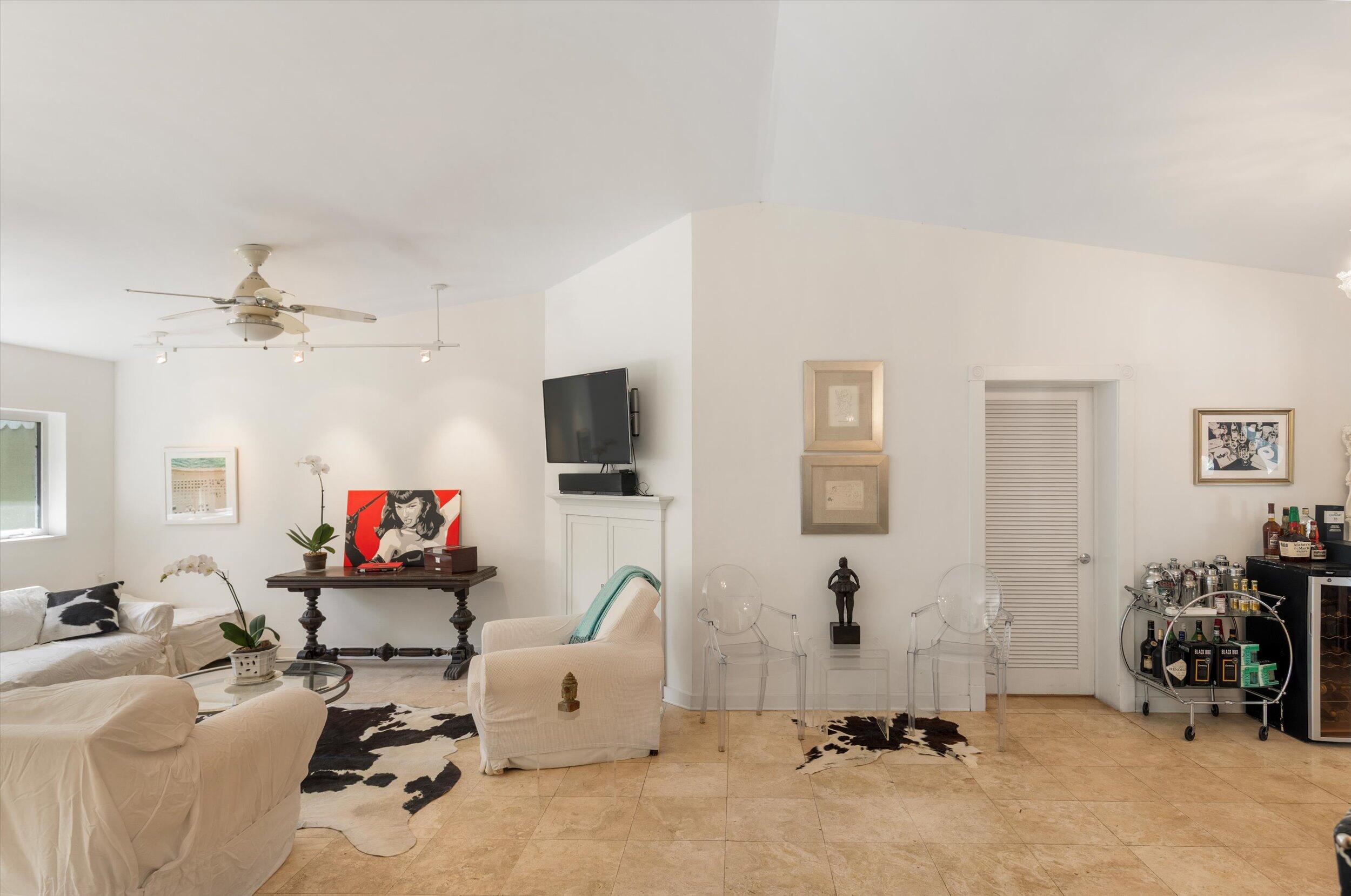 1719 Laird Street Key West, FL 33040 - Photo 9 of 39 a room with gym equipment and a flat screen tv