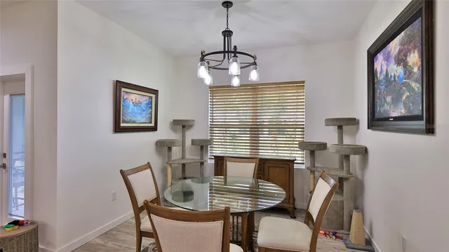 a dining room with furniture and window