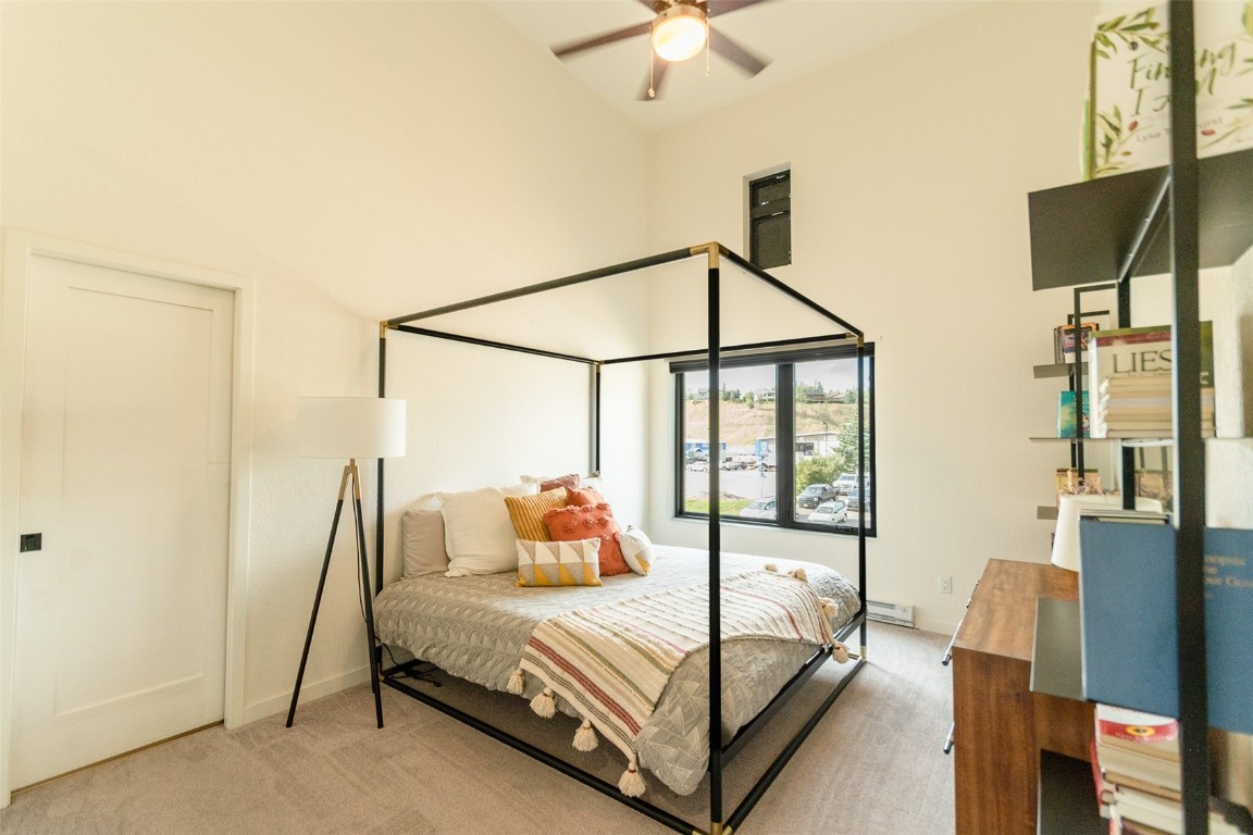 2507 Riverside Drive, Unit 302 Steamboat Springs, CO 80487 - Photo 13 of 32 Primary bedroom with lofted ceilings