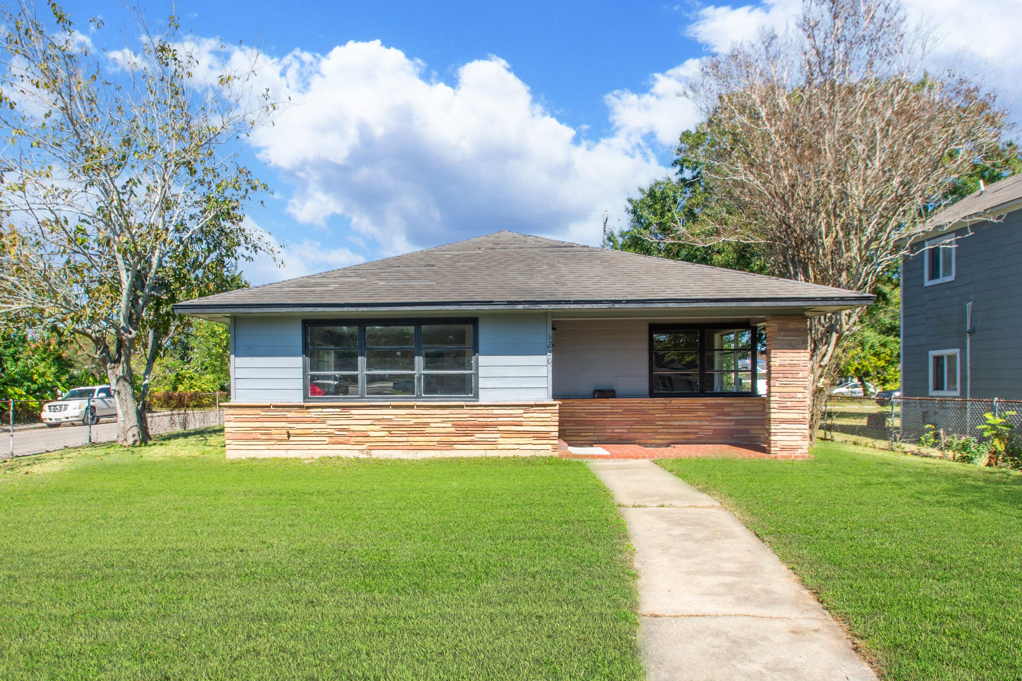 1230 West 4th Street Freeport, TX 77541 - Photo 45 of 49 Front photo. The only home that is allowed to have entire yard fenced.