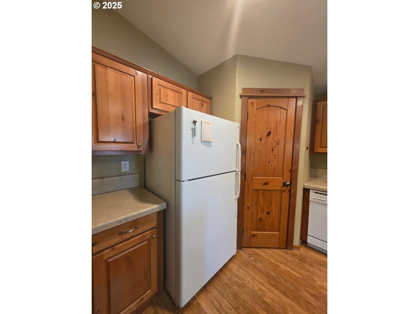 190 North Sentosa Lake Road Tygh Valley, OR 97063 - Photo 16 of 45 a white refrigerator freezer and a stove sitting inside of a kitchen