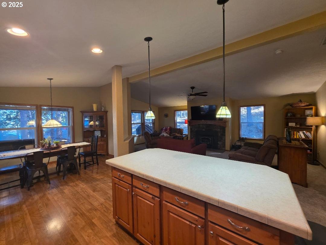 190 North Sentosa Lake Road Tygh Valley, OR 97063 - Photo 18 of 45 a large kitchen with kitchen island a sink table and chairs