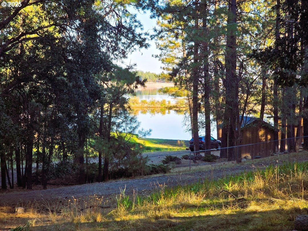 190 North Sentosa Lake Road Tygh Valley, OR 97063 - Photo 2 of 45 a view of a swimming pool with an outdoor space and seating area