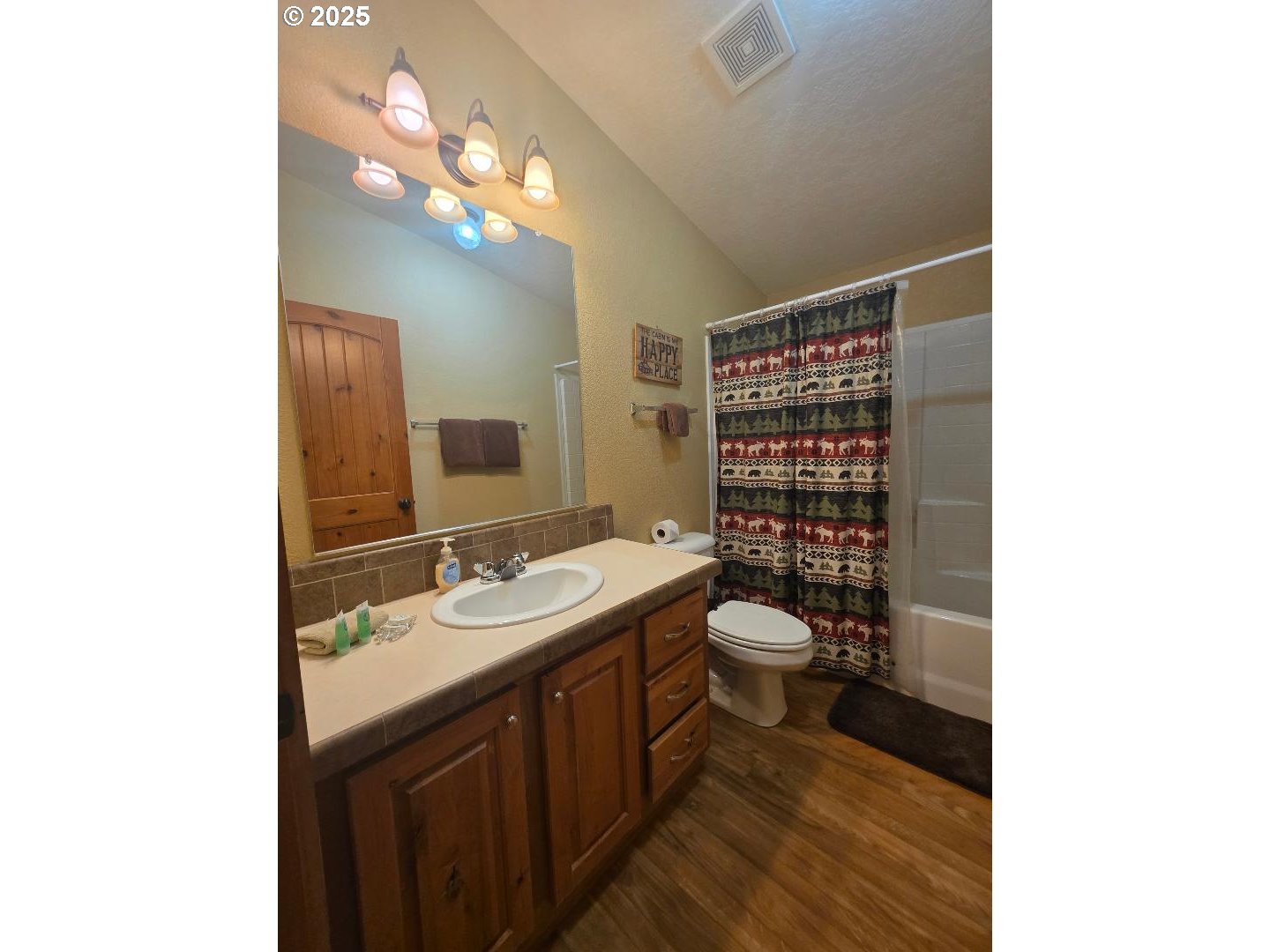 190 North Sentosa Lake Road Tygh Valley, OR 97063 - Photo 24 of 45 a bathroom with a toilet a sink and mirror