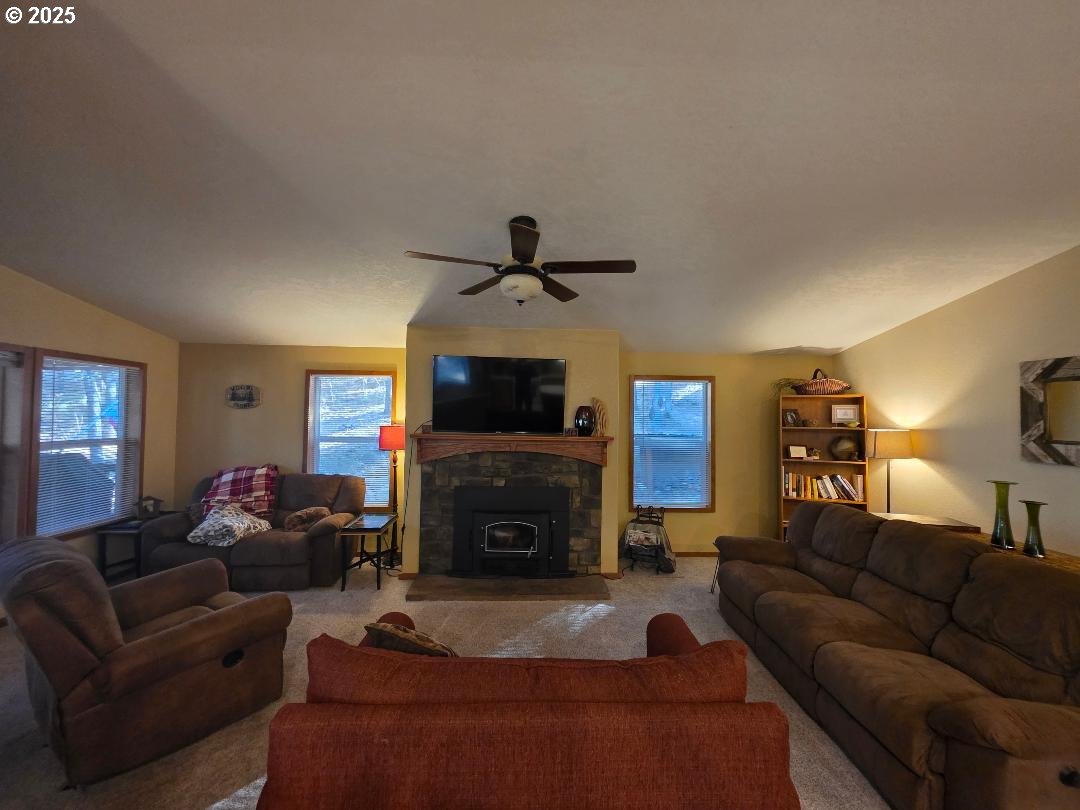 190 North Sentosa Lake Road Tygh Valley, OR 97063 - Photo 25 of 45 a living room with furniture a flat screen tv and a fireplace