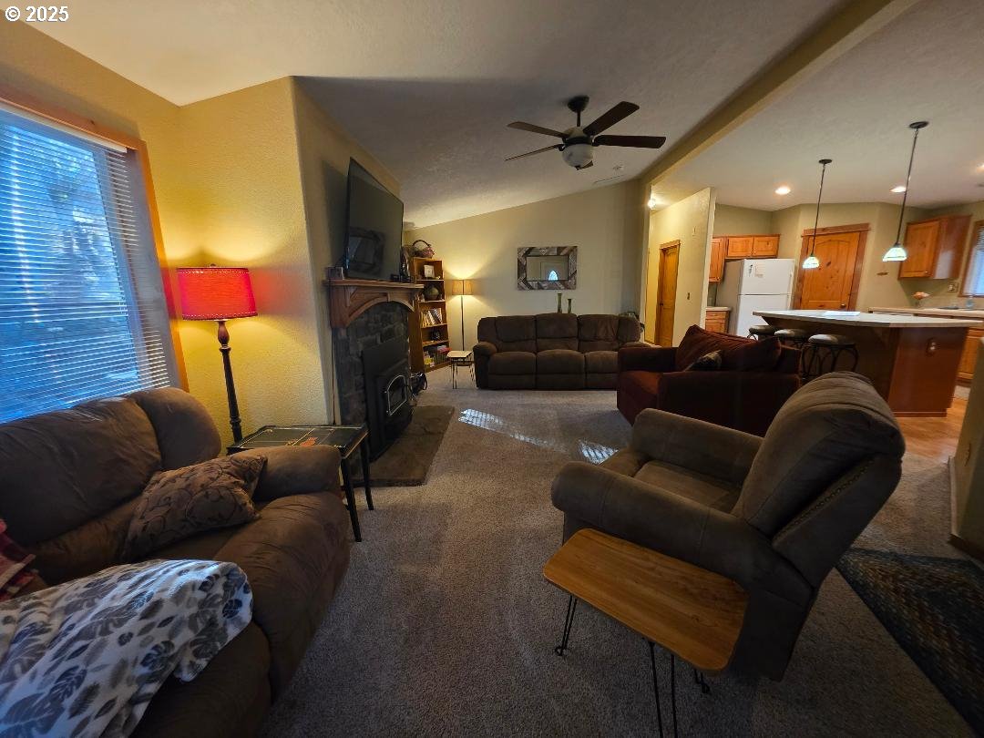 190 North Sentosa Lake Road Tygh Valley, OR 97063 - Photo 28 of 45 a living room with furniture and a fireplace