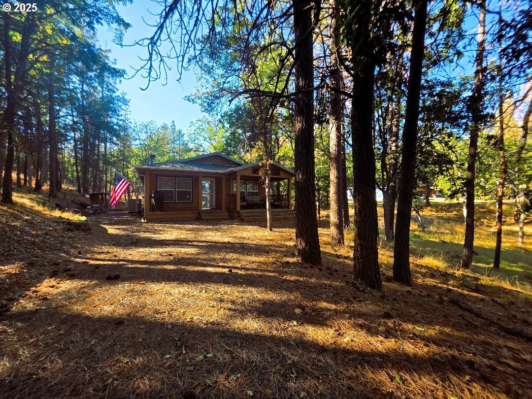 190 North Sentosa Lake Road Tygh Valley, OR 97063 - Photo 3 of 45 a view of house with backyard and tree