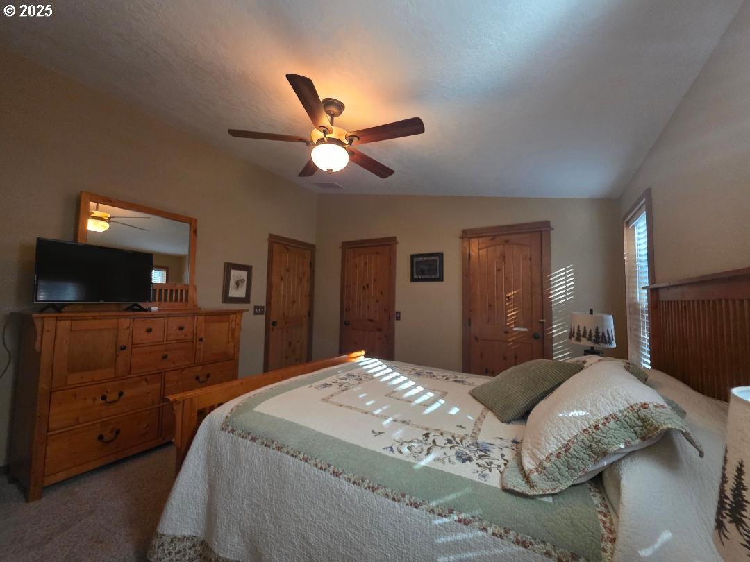 190 North Sentosa Lake Road Tygh Valley, OR 97063 - Photo 34 of 45 a bedroom with a bed and a flat screen tv