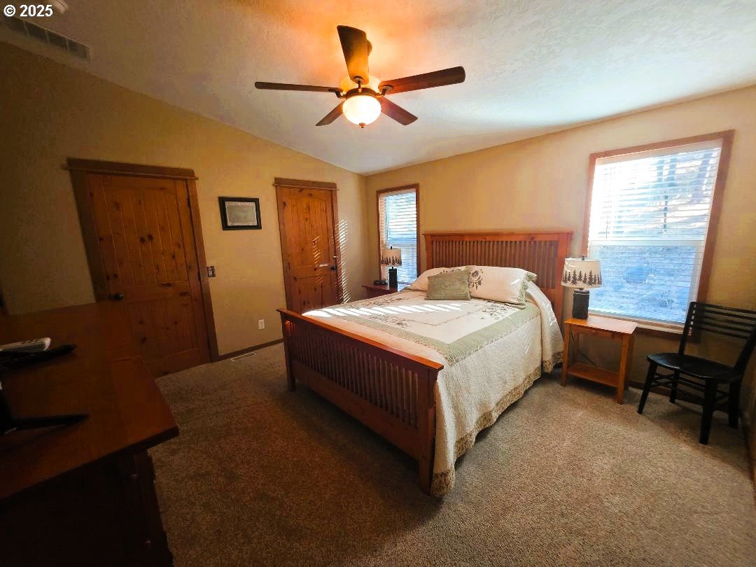 190 North Sentosa Lake Road Tygh Valley, OR 97063 - Photo 36 of 45 a bedroom with a bed and a window