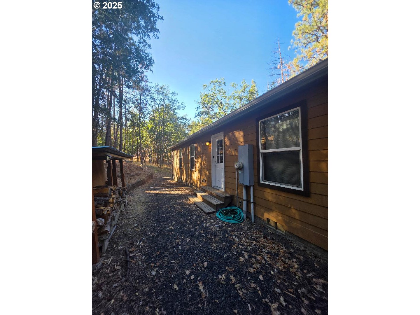190 North Sentosa Lake Road Tygh Valley, OR 97063 - Photo 10 of 45 a backyard of a house with lots of green space